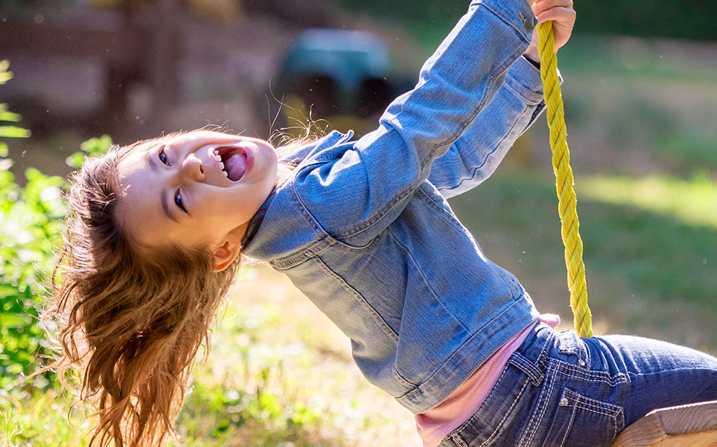 What should children pay attention to when playing on the swing?